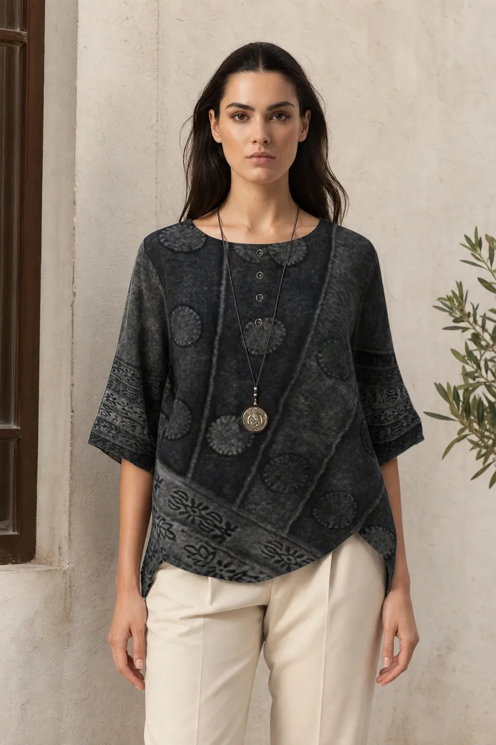 Gray boho print tunic blouse on model in contrapposto stance