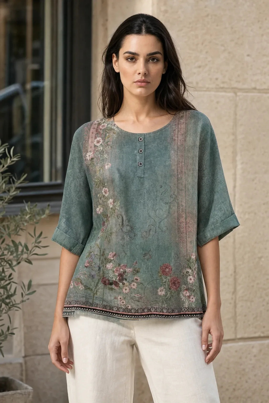 Green boho print tunic blouse on model in contrapposto stance