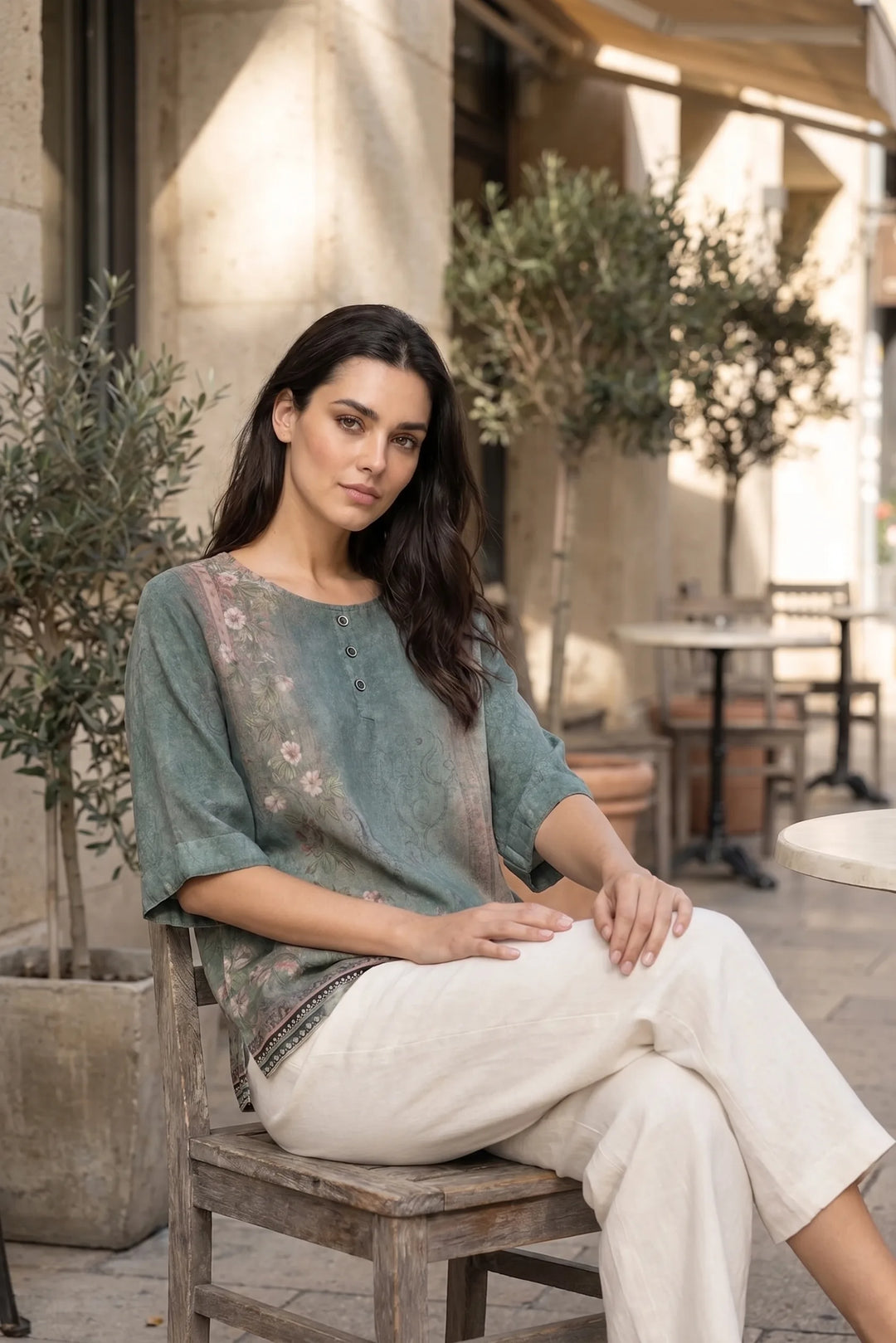 Model wearing green boho print tunic blouse in outdoor lifestyle setting