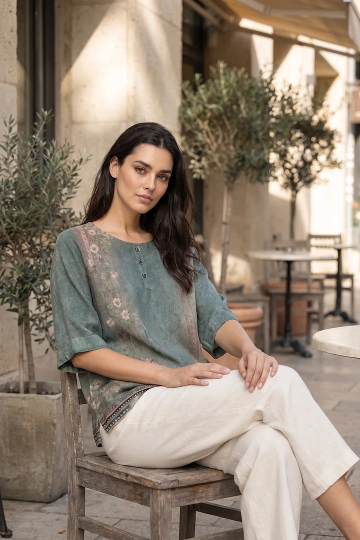 Model wearing green boho print tunic blouse in outdoor lifestyle setting