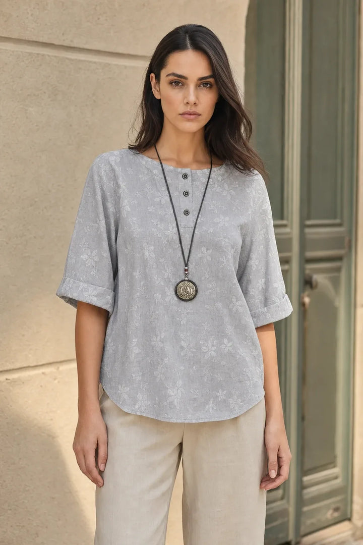 Light gray boho print tunic blouse on model in contrapposto stance