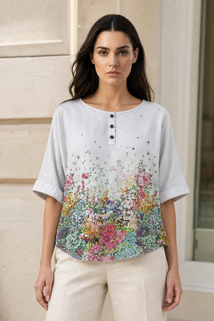 White boho print tunic blouse on model in contrapposto stance