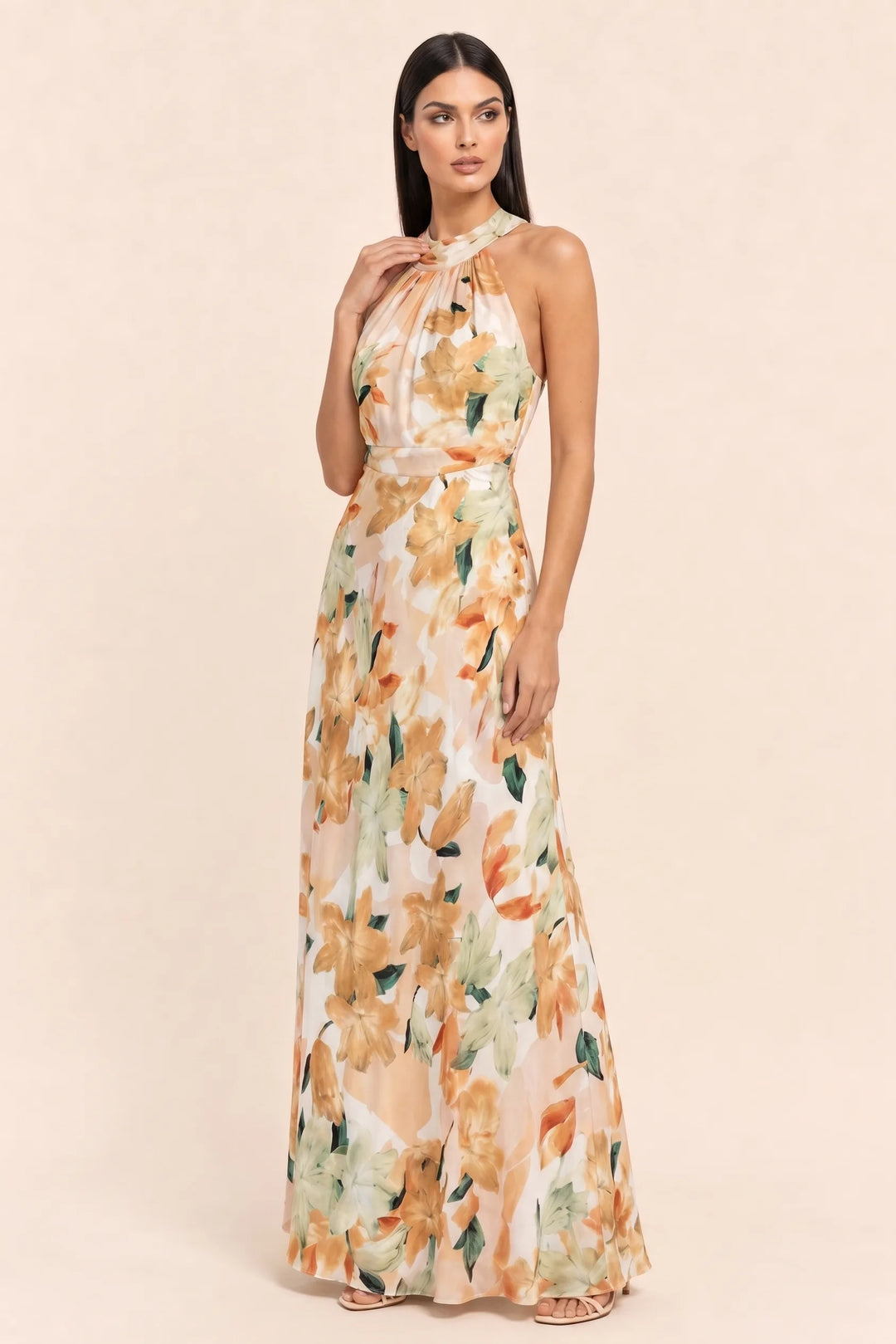 Floral halter maxi dress on model in three-quarter turn