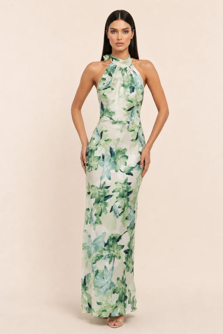 Green floral halter maxi dress on model in contrapposto stance