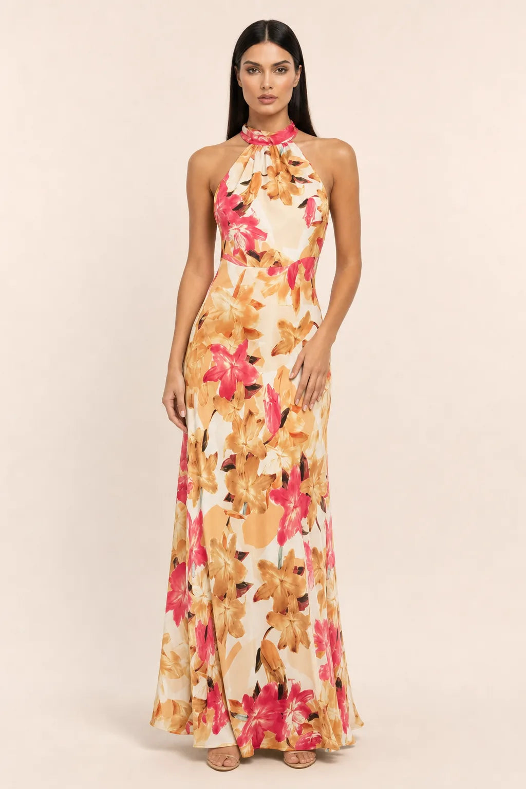 Rose pink floral halter maxi dress on model in contrapposto stance
