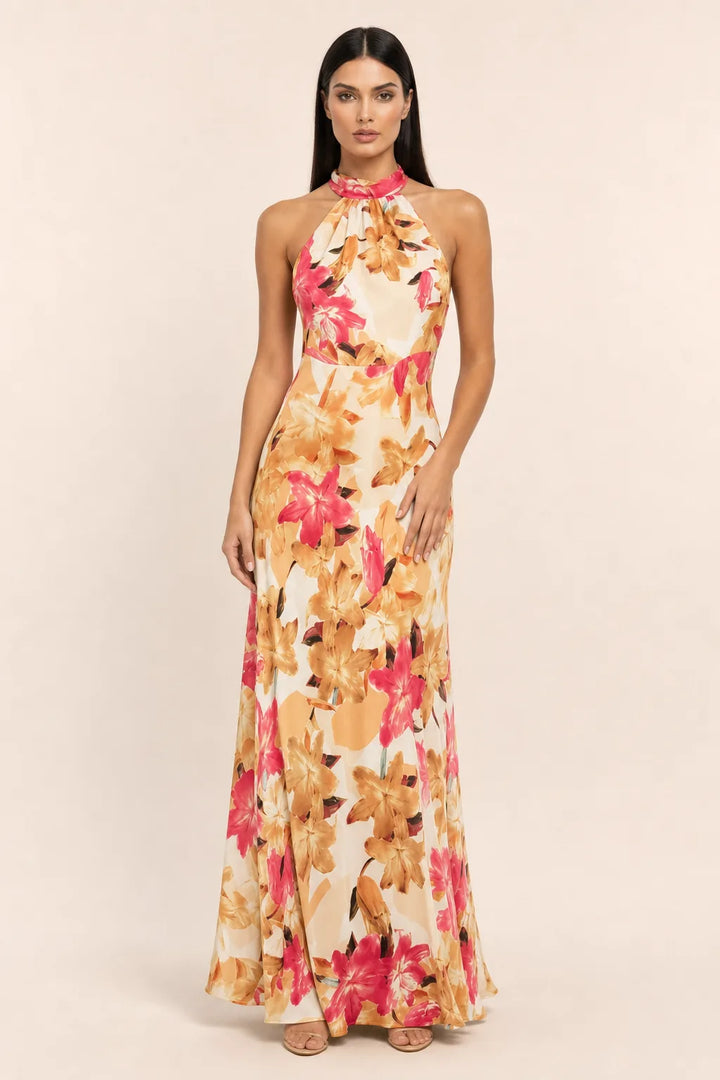 Rose pink floral halter maxi dress on model in contrapposto stance