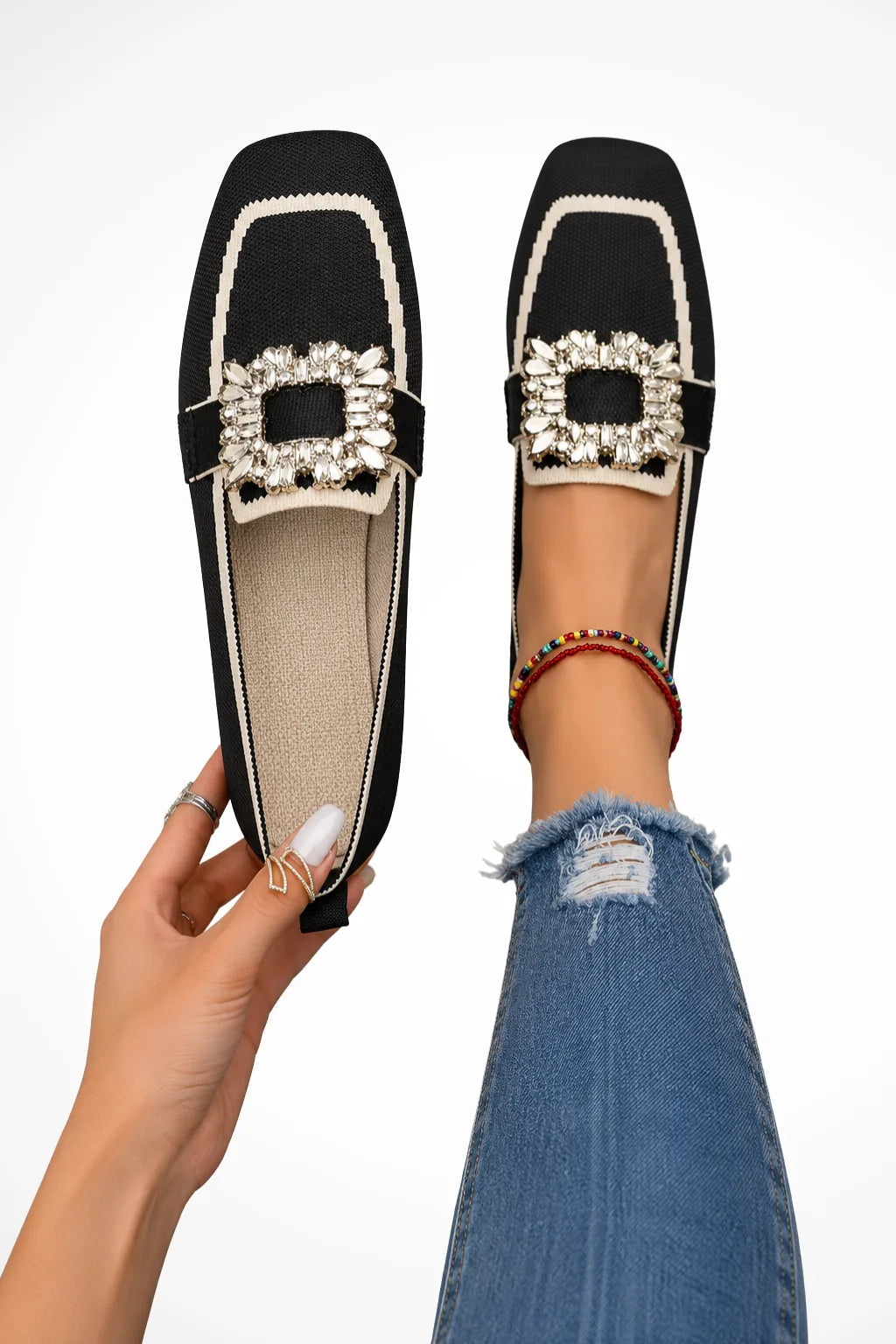 Black loafer with jewelled buckle detail, front view