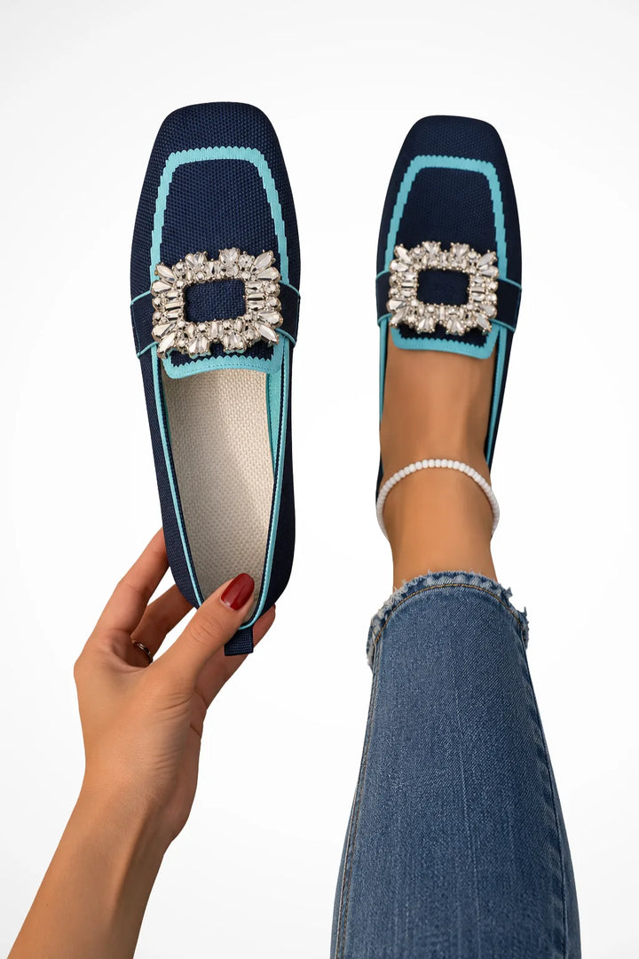 Blue loafer with jewelled buckle detail, front view
