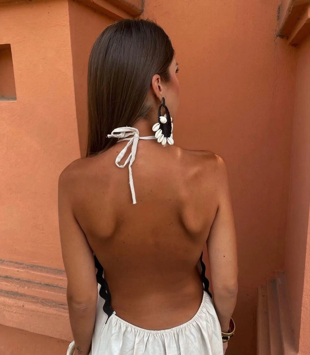 Close-up detail of ric rac trim on a black maxi dress