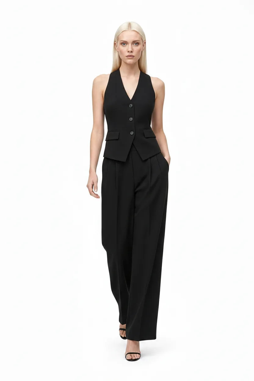 Black halter vest and wide-leg trouser co-ord set on model in natural movement