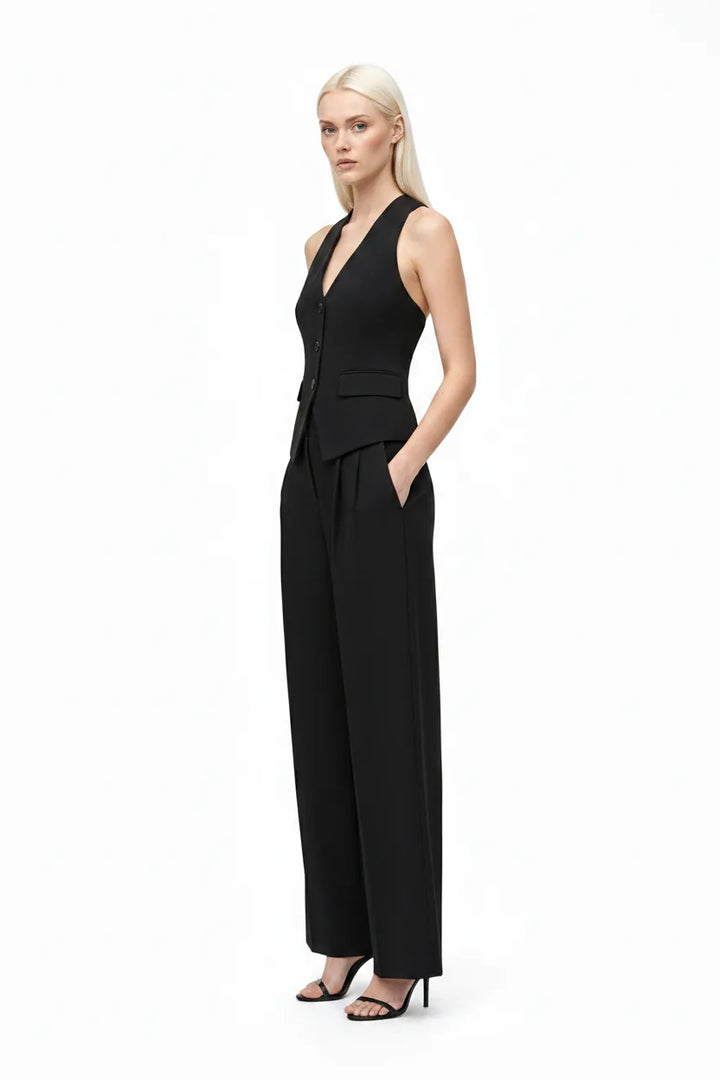 Black halter vest and wide-leg trouser co-ord set on model in three-quarter turn