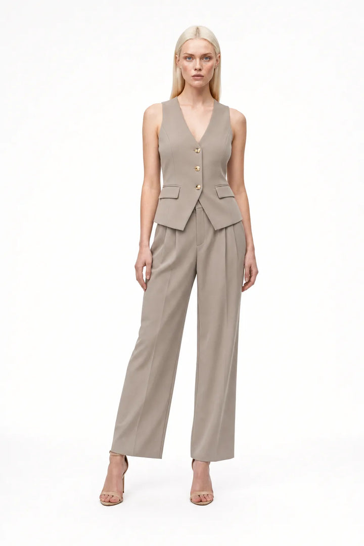 Khaki halter vest and wide-leg trouser co-ord set on model in contrapposto stance