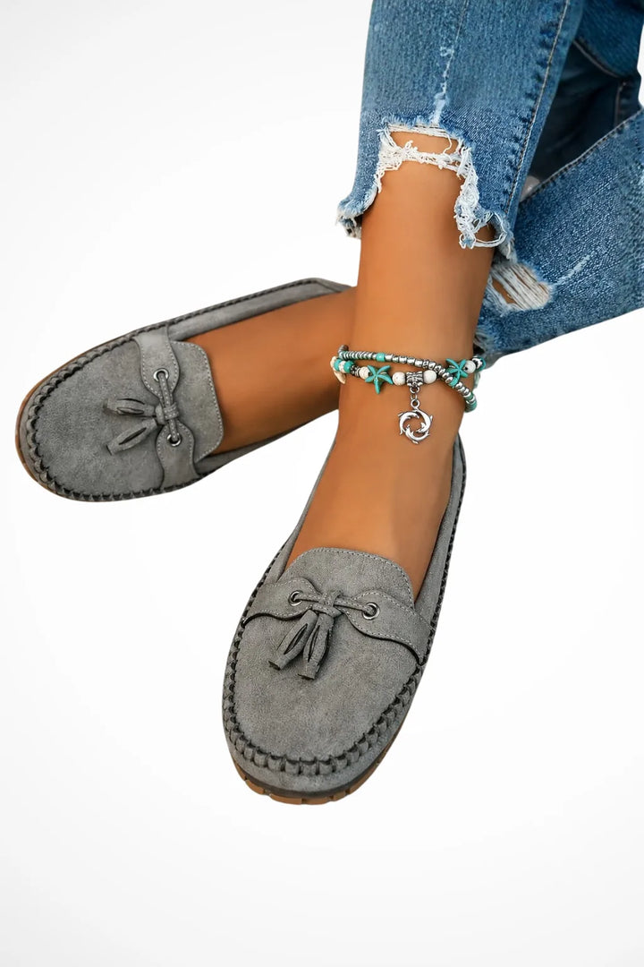 Grey suede tassel loafer, front view