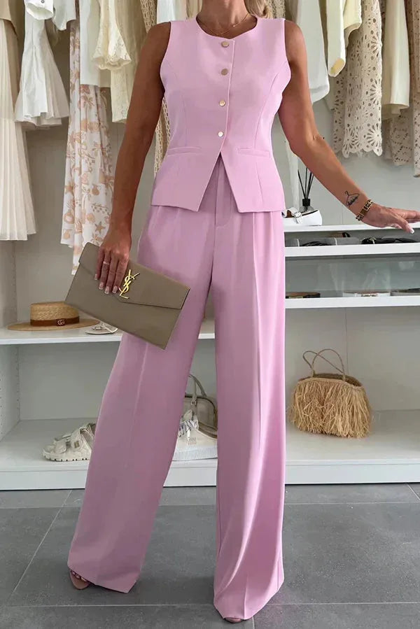 Model in a yellow vest trouser suit shown in a dynamic full-length stance