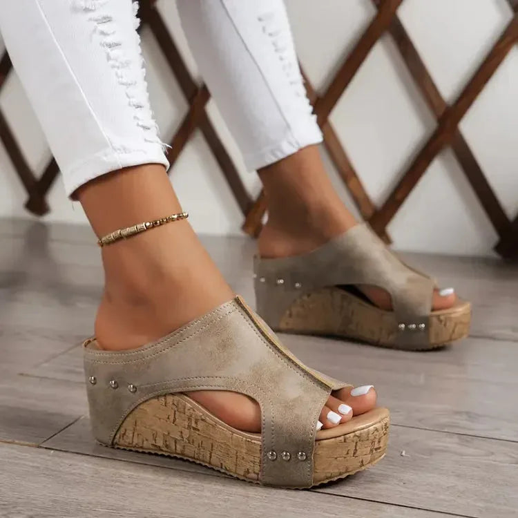 Close-up detail of beige cork wedge platform mule