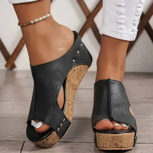 Black cork wedge platform mule in side profile view