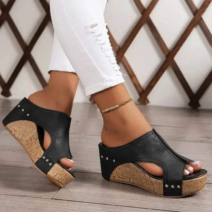 Black cork wedge platform mule in three-quarter angle view