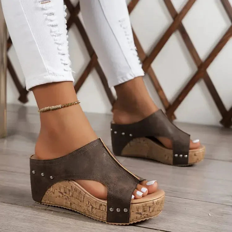 Brown cork wedge platform mule showing heel construction