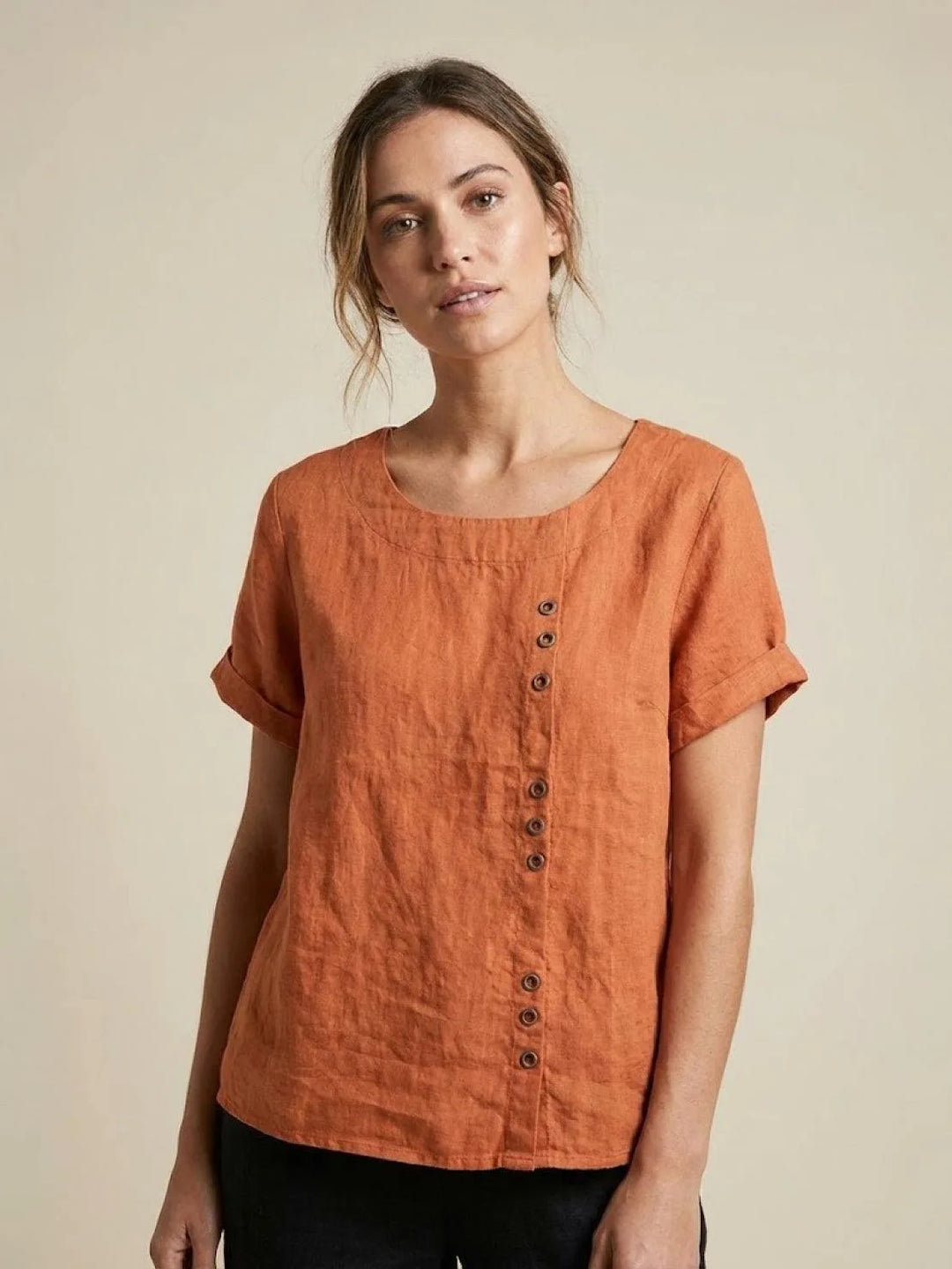 Orange button detail scoop neck top on model