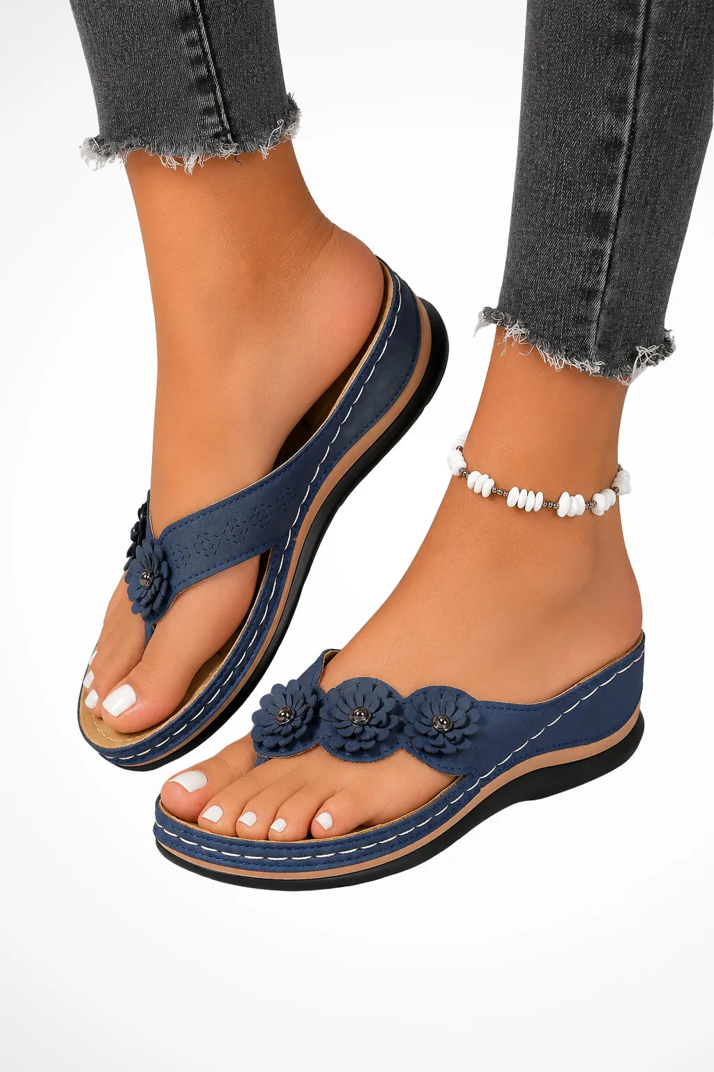 Navy blue floral wedge thong sandal, front view