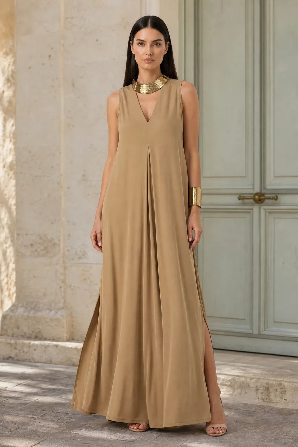 Coffee-toned pleat-front maxi dress on model in contrapposto stance