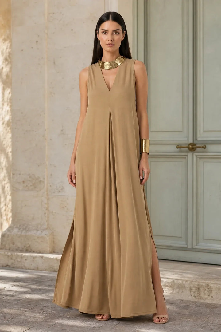 Coffee-toned pleat-front maxi dress on model in contrapposto stance