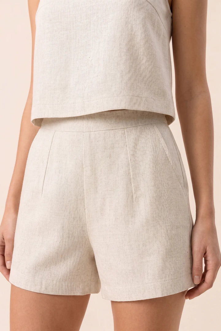 Close-up detail of apricot crop top and shorts set fabric and fit