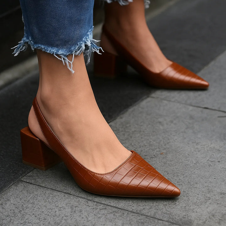 Brown croc-embossed slingback pump, side profile view