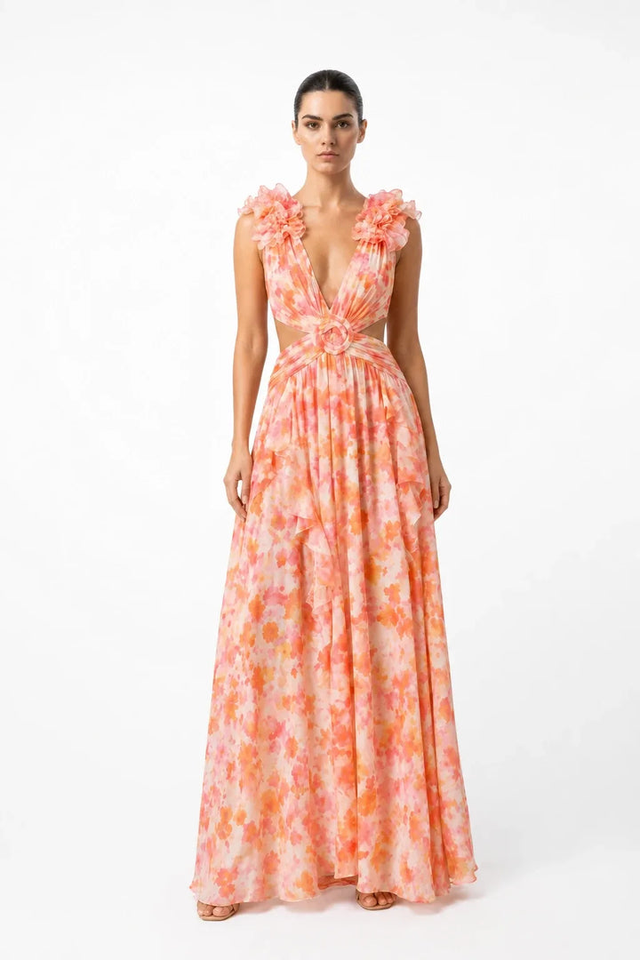 Orange ruffle-shoulder maxi dress on model in contrapposto stance