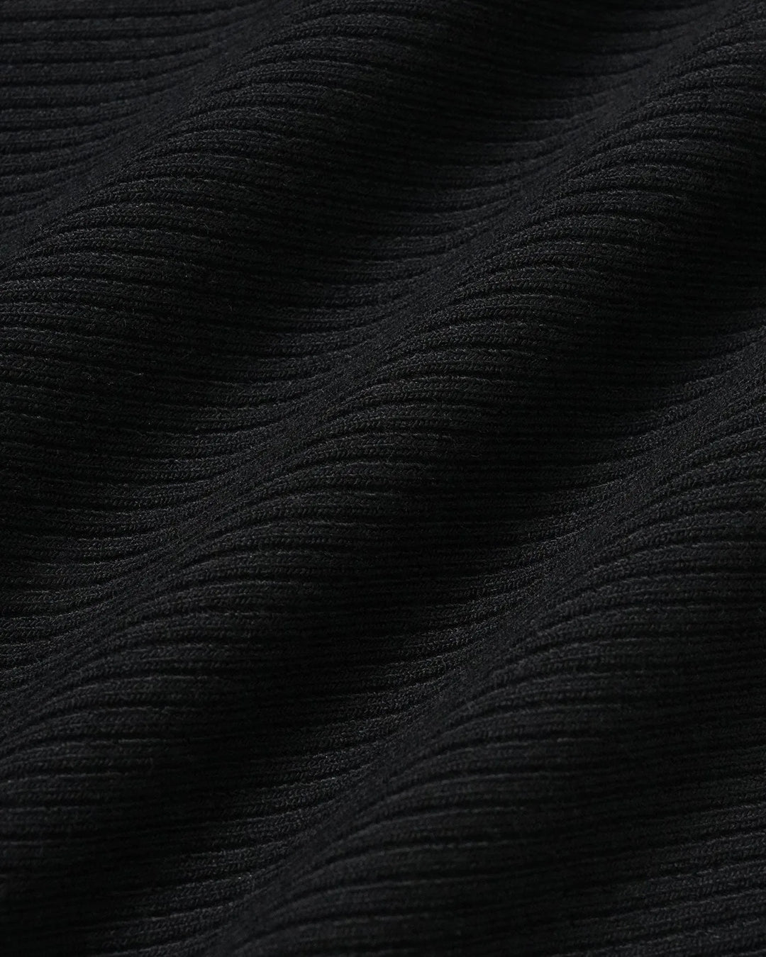 Black sweetheart neck bodysuit on model, styled full-body view of sleek fitted design