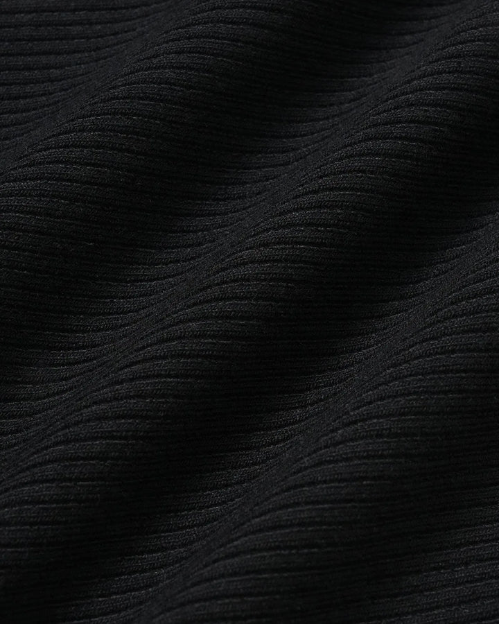 Black sweetheart neck bodysuit on model, styled full-body view of sleek fitted design