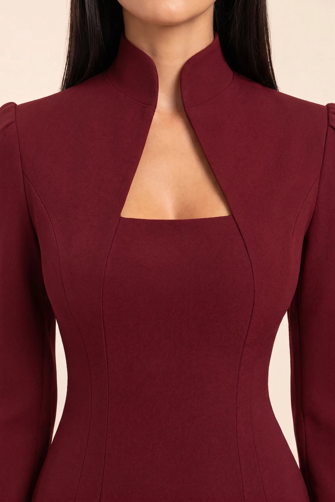 Close-up detail of burgundy mock neck cutout bodycon dress