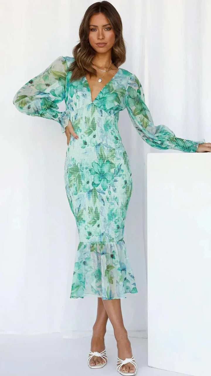 Green floral ruffle midi dress on model, full-length view