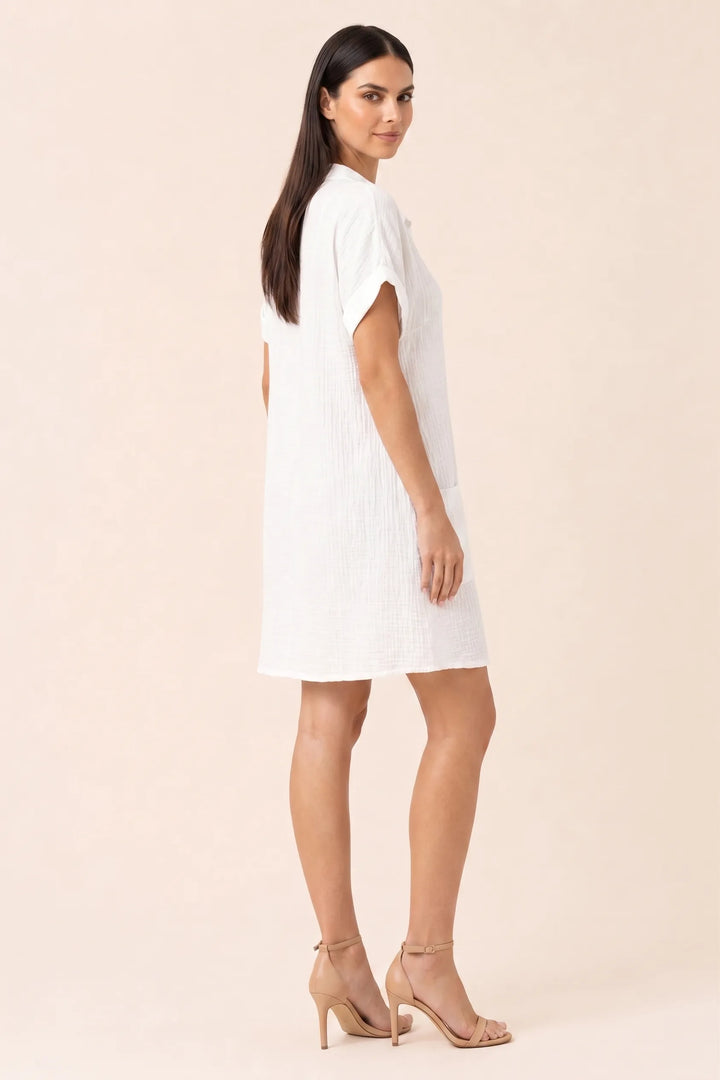 White button-front shirt dress on model in three-quarter turn