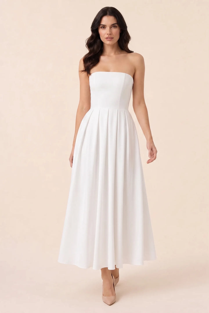 White strapless pleated midi dress on model in three-quarter turn