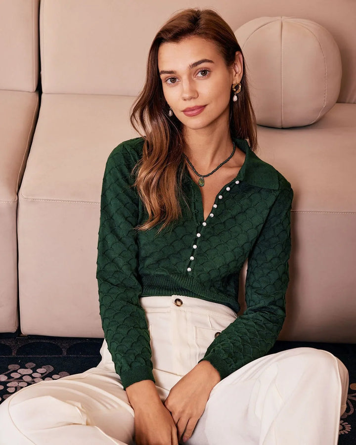 Dark green knit polo top with pearl buttons, model facing front
