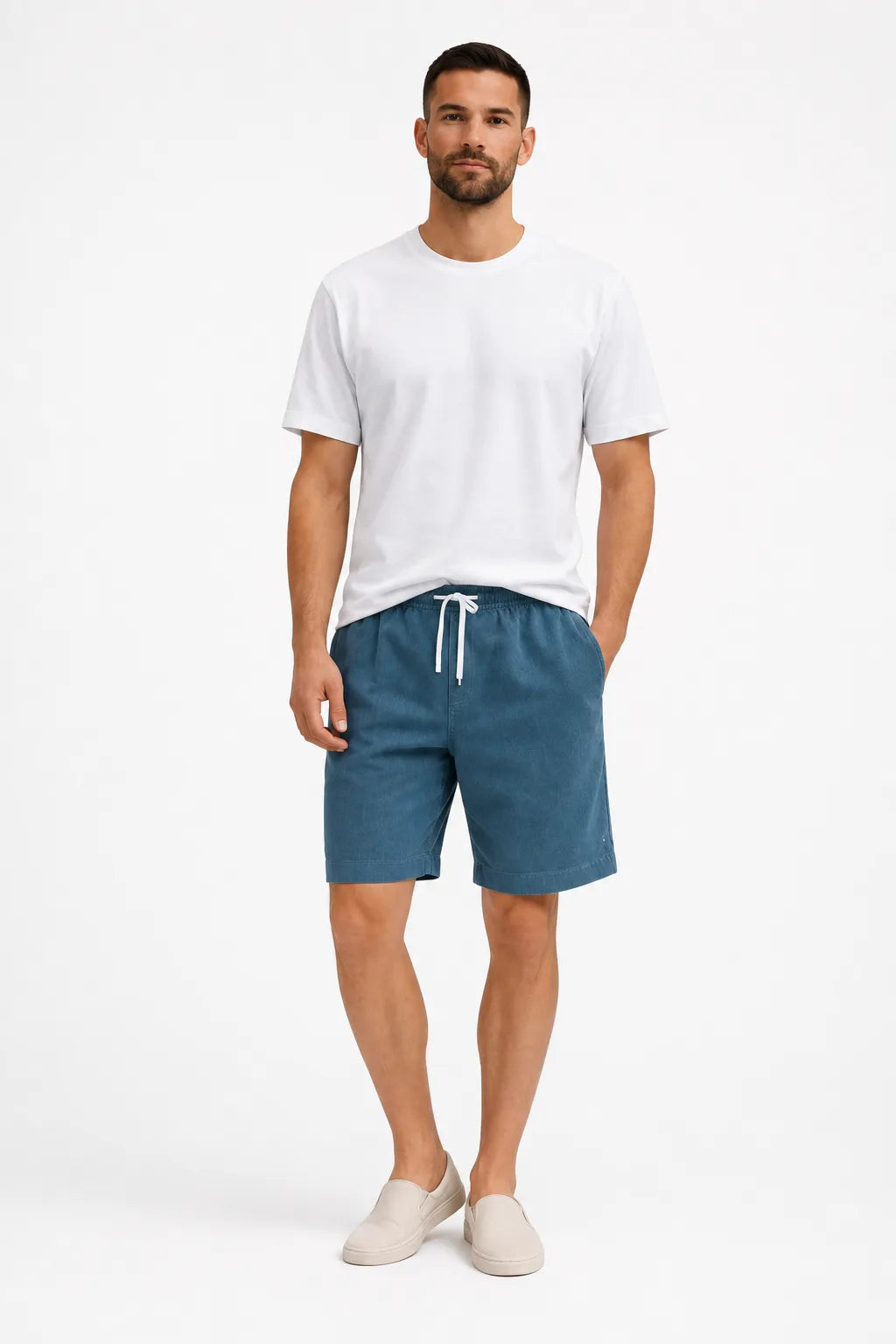 Blue corduroy drawstring shorts on a model in a contrapposto stance
