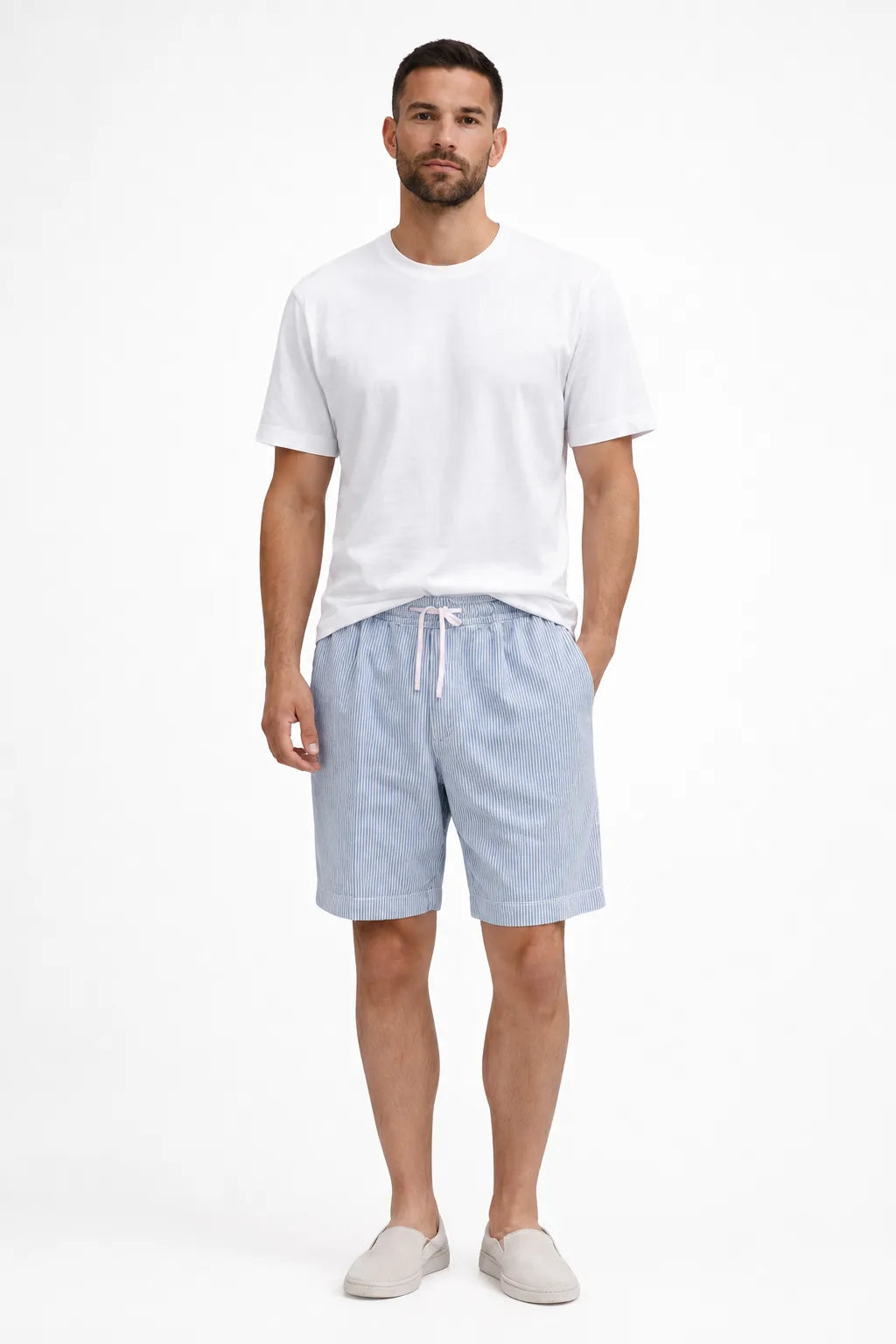 Light blue corduroy drawstring shorts on a model in a contrapposto stance