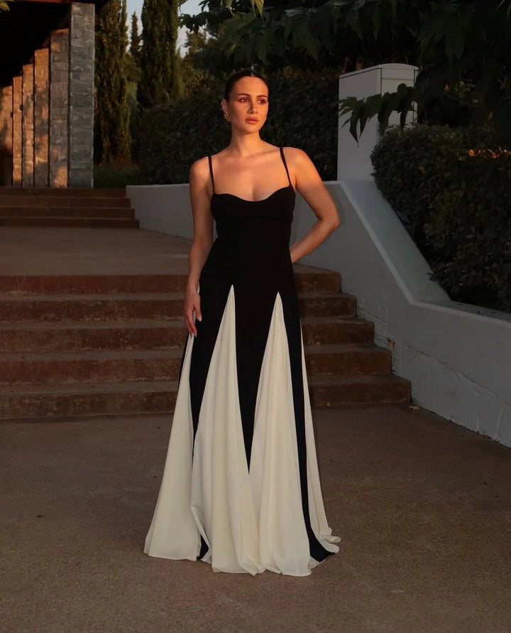 Close-up detail of black and white color block gown fabric and construction