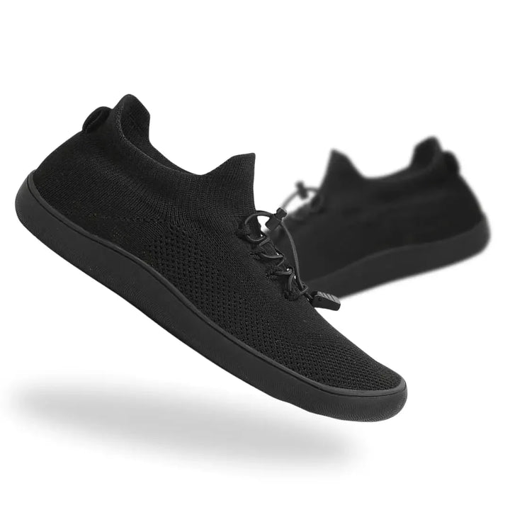 Black barefoot knit sneaker, side profile view
