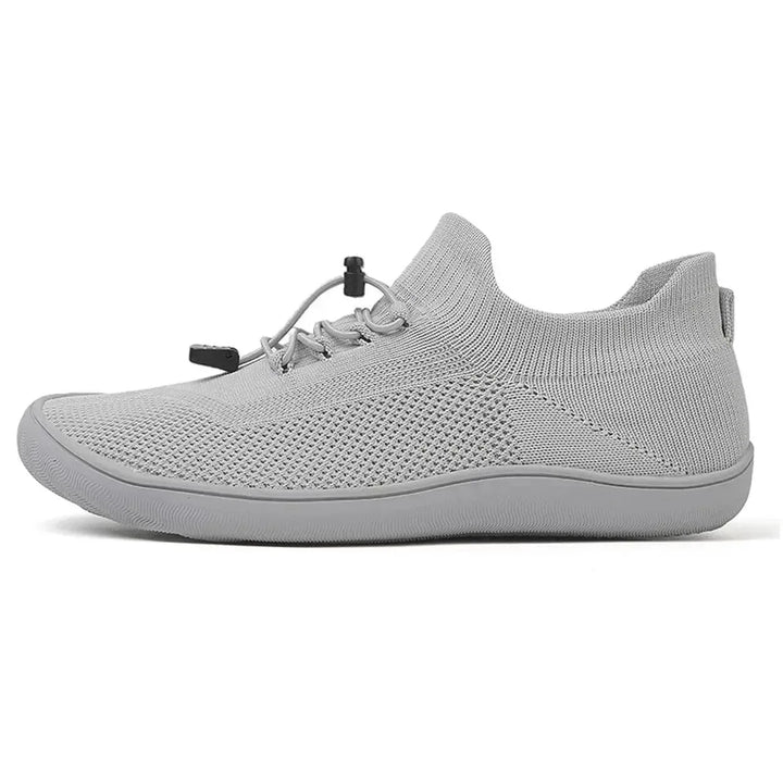 Gray barefoot knit sneaker, side profile view