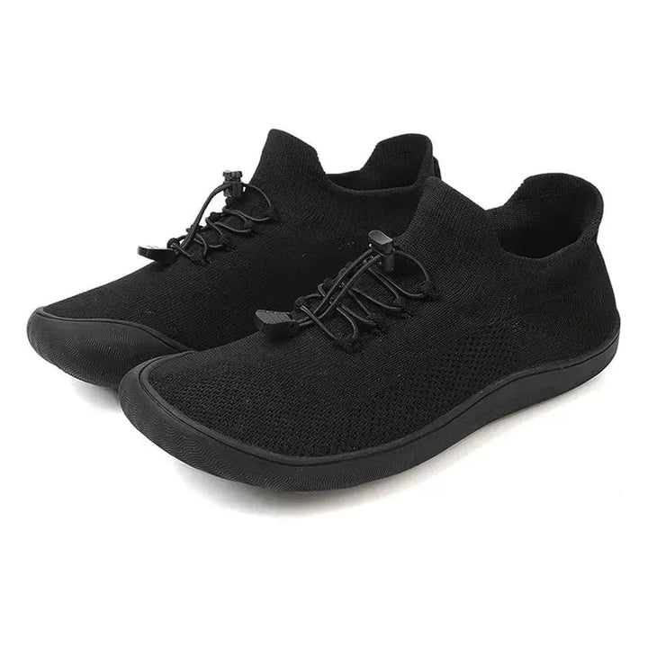 Gray barefoot knit sneaker, lifestyle on-foot view