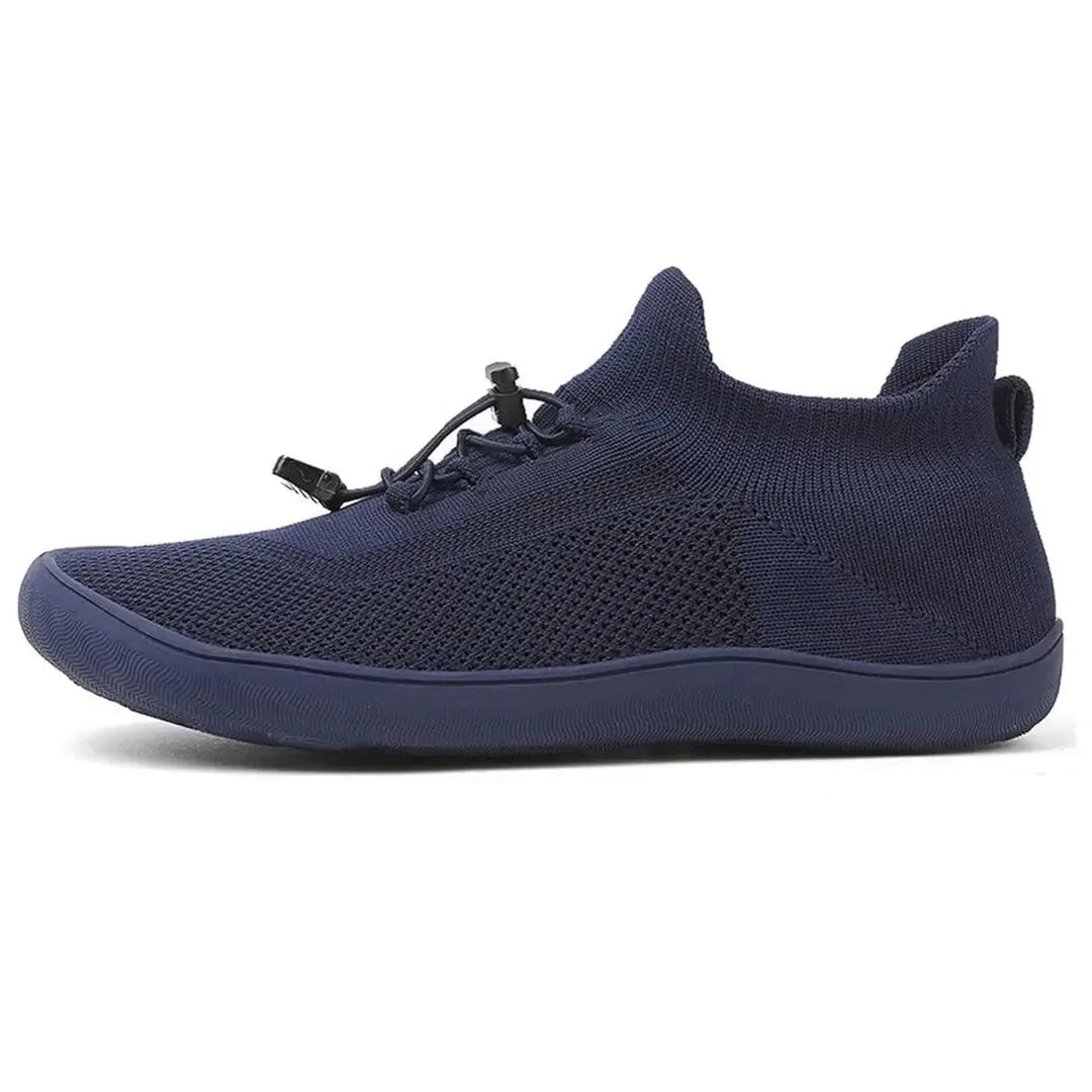 Gray barefoot knit sneaker, lifestyle flat lay view
