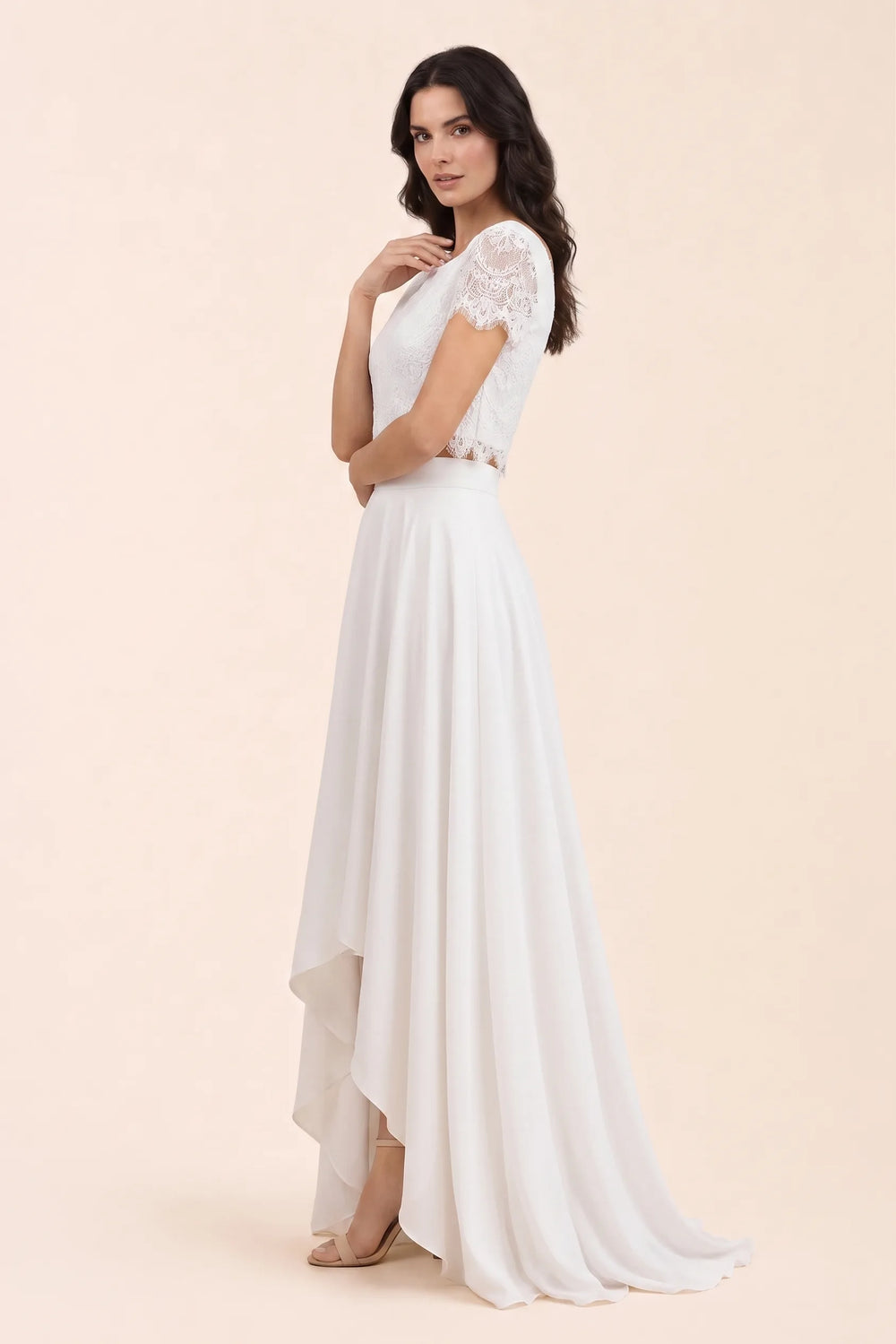 White lace crop top and midi skirt set on a model in a three-quarter turn