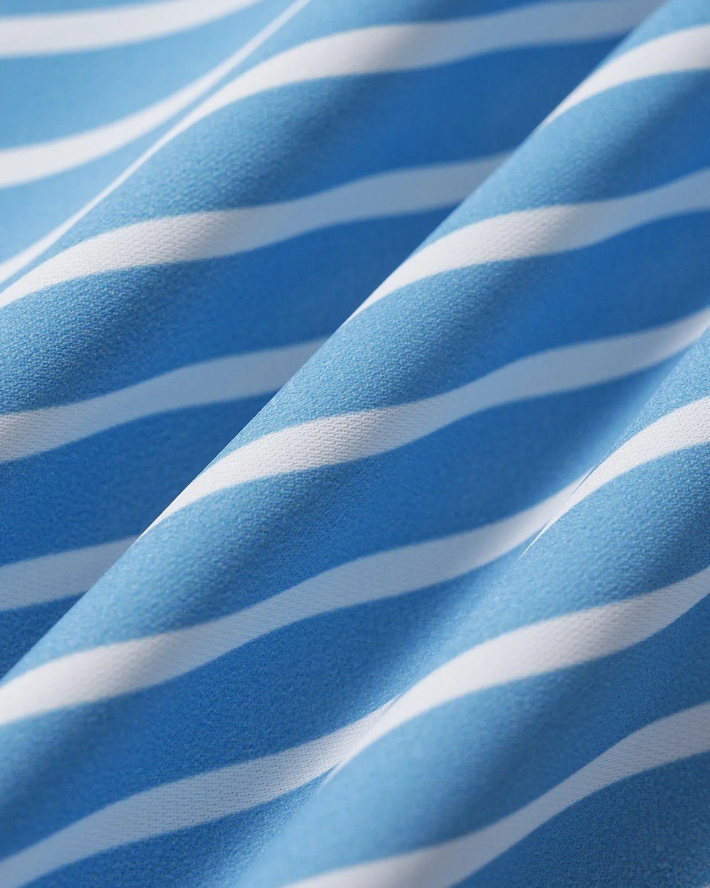 Close-up detail of a blue puff sleeve blouse showing fabric and sleeve construction