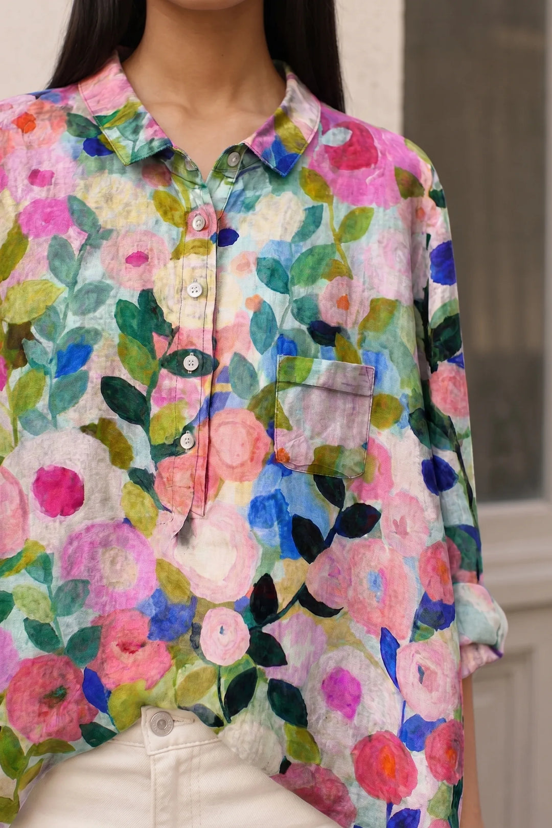 Close-up detail of a floral print blouse showing fabric texture and pattern
