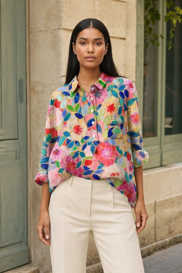 Floral print blouse in a twelfth colorway on a model in a contrapposto stance