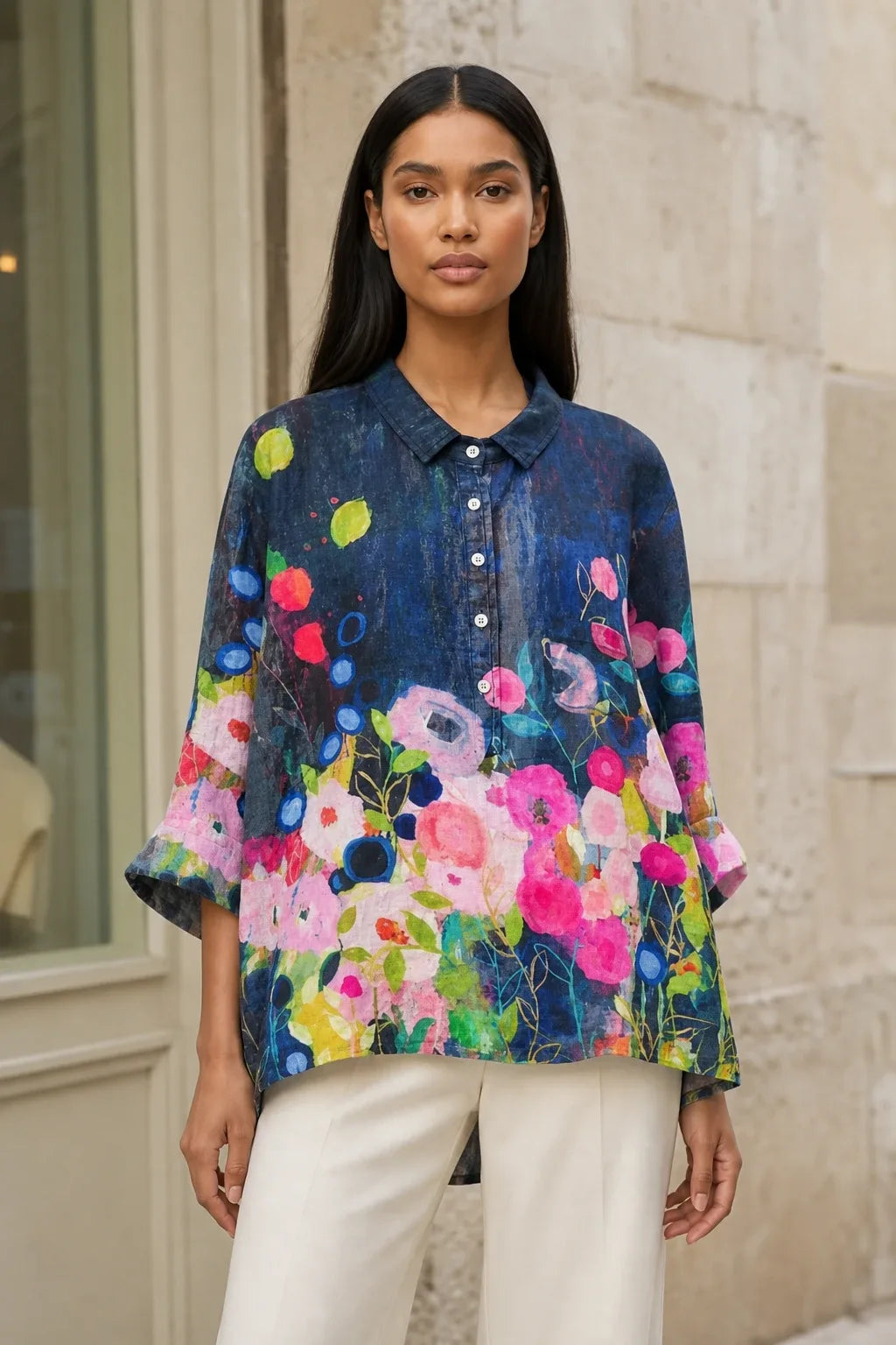 Floral print blouse in a thirteenth colorway on a model in a contrapposto stance
