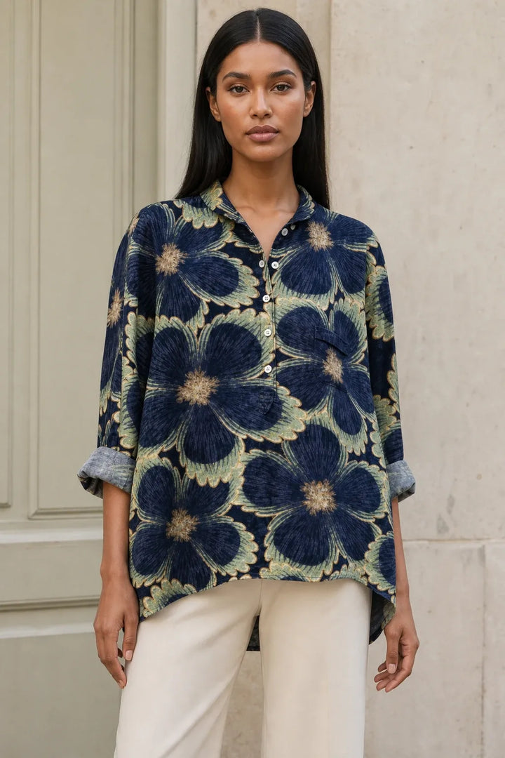 Floral print blouse in a second colorway on a model in a contrapposto stance