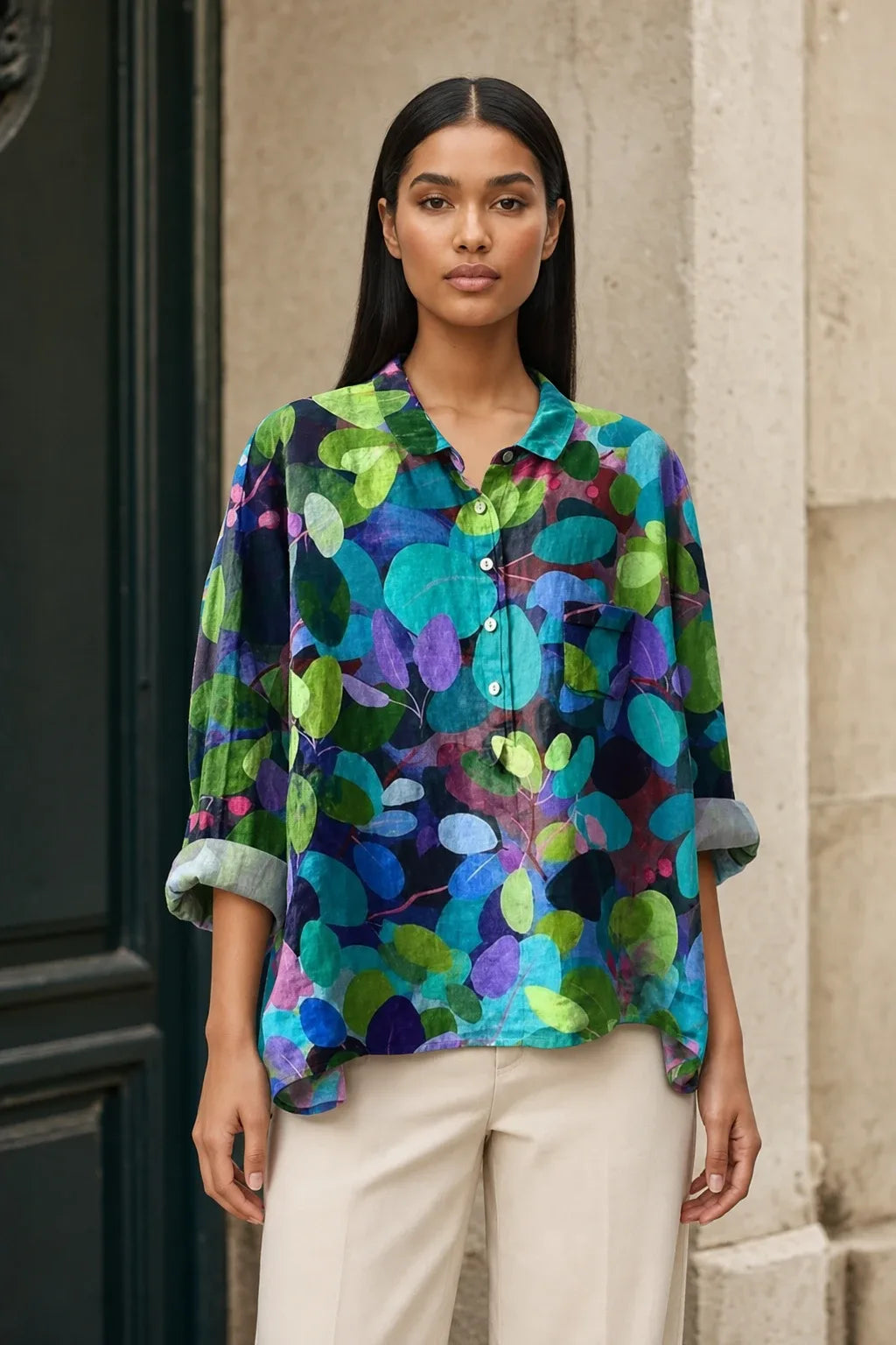 Floral print blouse in a seventh colorway on a model in a contrapposto stance